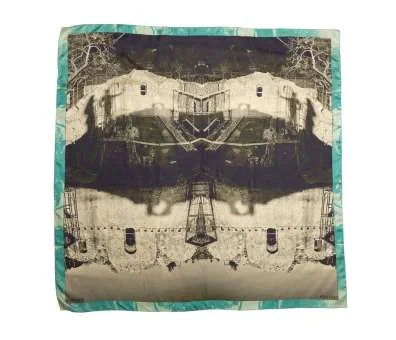 The Prastos scarf: a mirrored black and beige photograph of village ruins, with a teal border